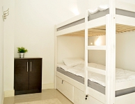 Private economic room for 2 person with bunk bed and airconditioning. No window, daylight coming through the skylight. Size 7 m2. Shared bathroom.